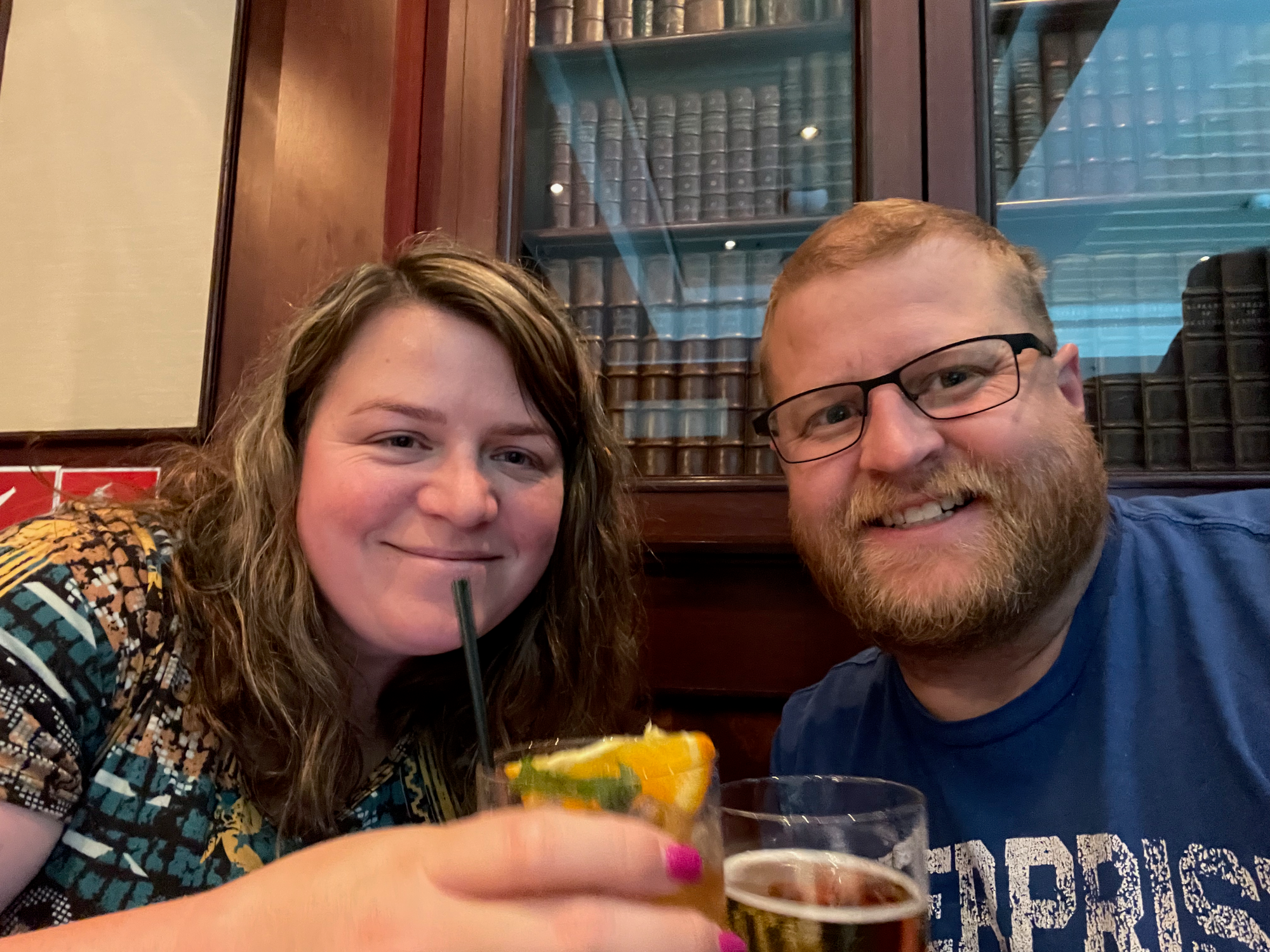 Adam and Lindsay at airport bar before a flight