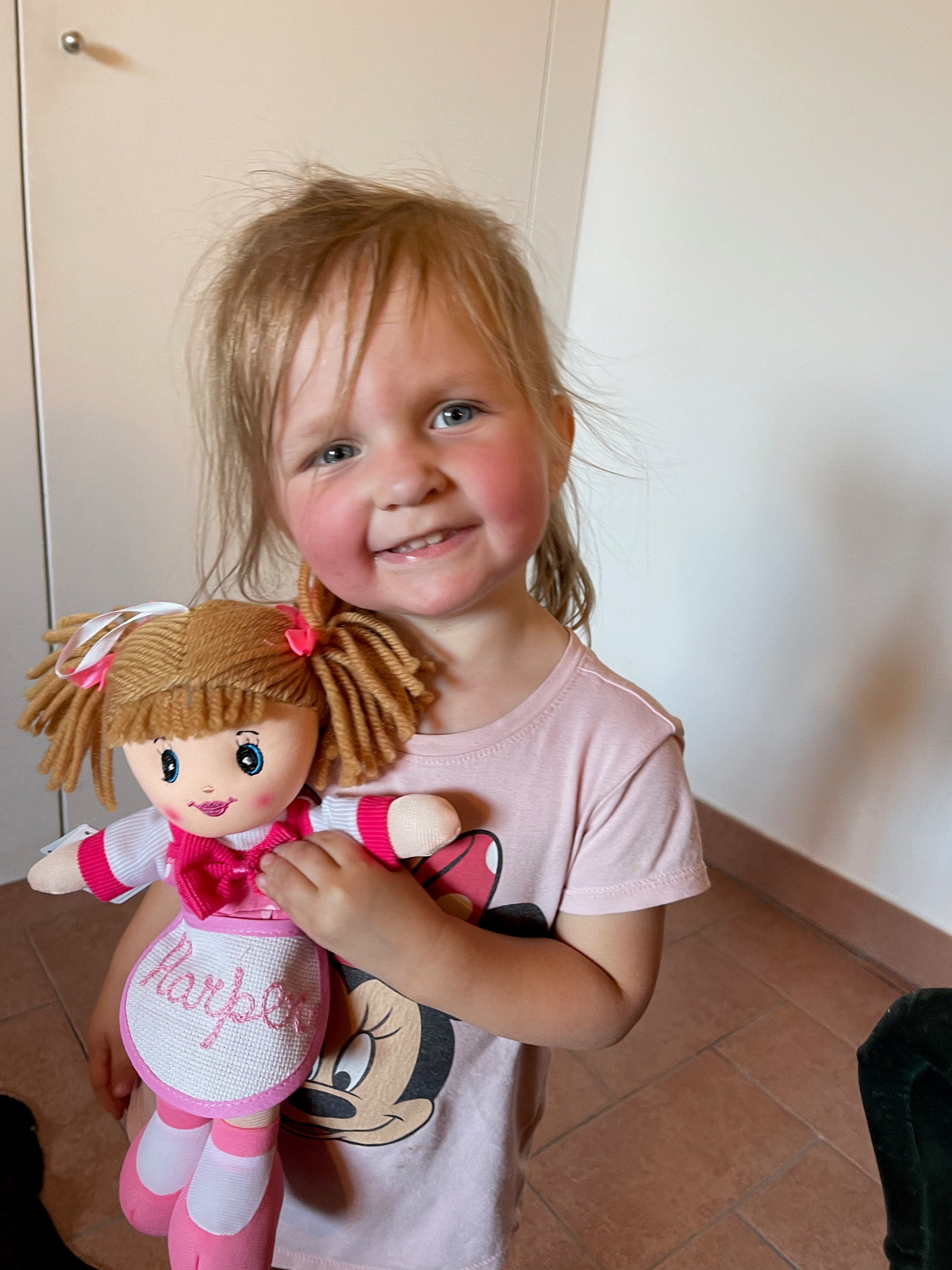 Harper with birthday doll in Lucca Italy June 2022