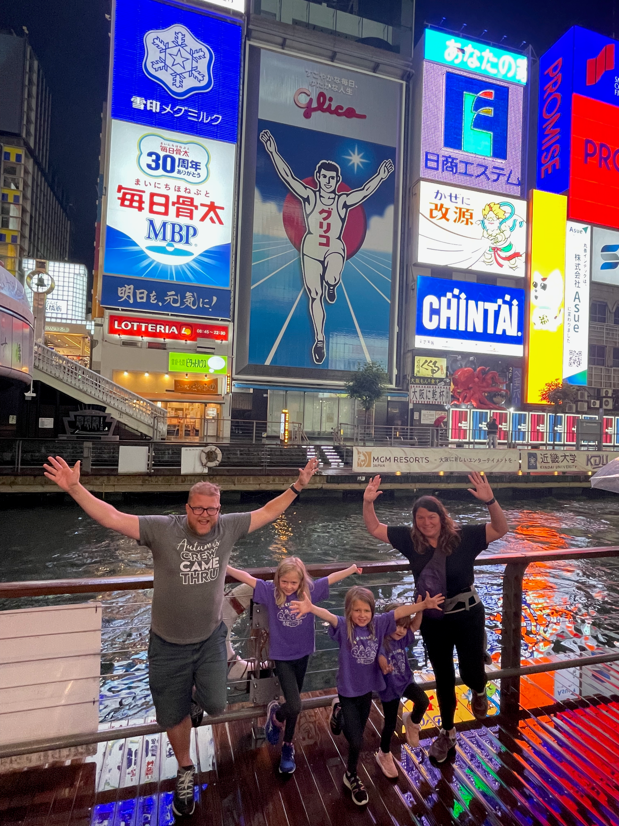 The Clarkson family in front of the Glico sign in Dotonbori Osaka Japan June 2023